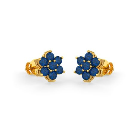 Blue sapphires set in gold in a floral pattern