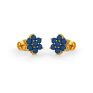Blue sapphires set in gold in a floral pattern